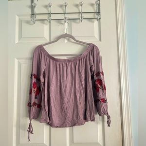 American Eagle Woman’s purple off-the-shoulder blouse with red flowers